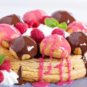 saint honore cake with chocolate and raspberry